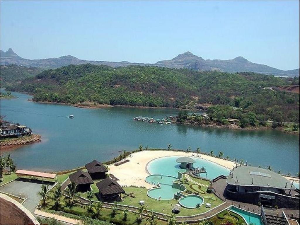 Aamby Valley City Lonavala Exterior photo View of the lake at the resort